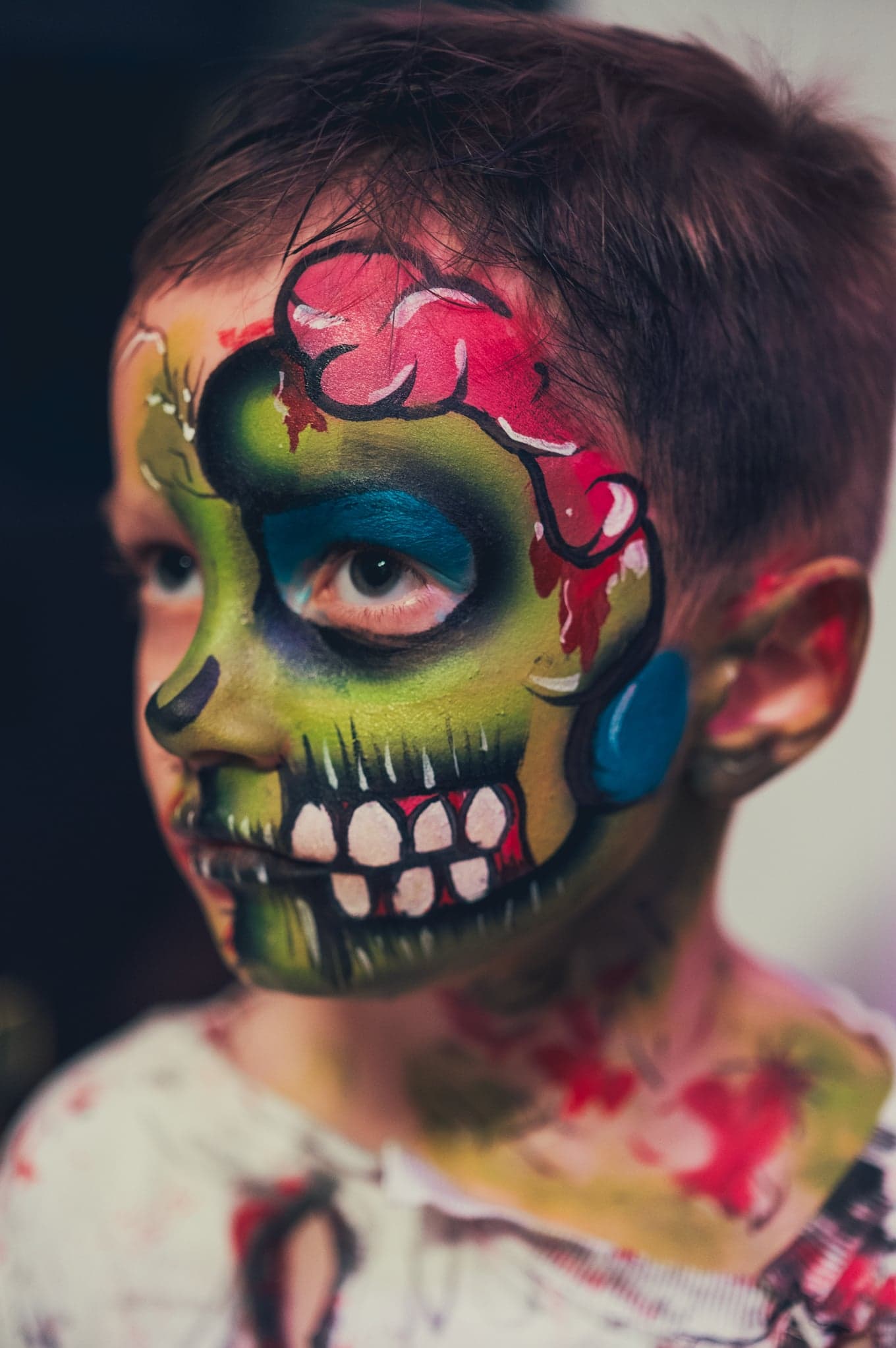 Bright green zombie face paint design
